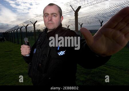 UK Police Officer using Incapacitant Spray Stock Photo