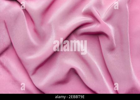 Pink silky elegant fabric as a background Stock Photo
