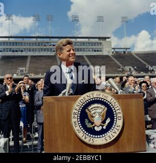 Inspection tour of NASA installations: Houston, Texas, motorcade, address at Rice University, 9:34AM. President John F. Kennedy delivers remarks at Rice University regarding the nationu0027s efforts in space exploration. Standing in back on speakersu0027 platform (applauding): Vice President Lyndon B. Johnson; Representative Albert Thomas (Texas); Representative George P. Miller (California). Rice University Stadium, Houston, Texas. Stock Photo