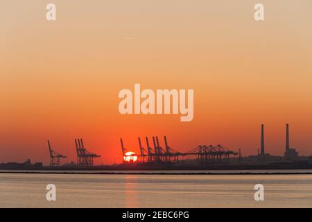 Sunset view of industrial port of Le Havre from Honfleur Stock Photo