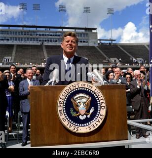 Inspection tour of NASA installations: Houston, Texas, motorcade, address at Rice University, 9:34AM. President John F. Kennedy delivers remarks at Rice University regarding the nationu0027s efforts in space exploration. Standing in back on speakersu0027 platform (applauding): Mayor of Houston, Lewis Cutrer; Representative Albert Thomas (Texas); Representative George P. Miller (California). Rice University Stadium, Houston, Texas. Stock Photo