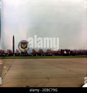 Trip to Europe: Germany, Hanau: Arrival at Fliegerhorst Kaserne, address, and inspection of troops and equipment, 10:45AM. President John F. Kennedyu2019s motorcade passes by troops and military equipment during an inspection at Fliegerhorst Kaserne in Hanau, West Germany (Federal Republic). [Blemishes throughout image are original to the negative.] Stock Photo