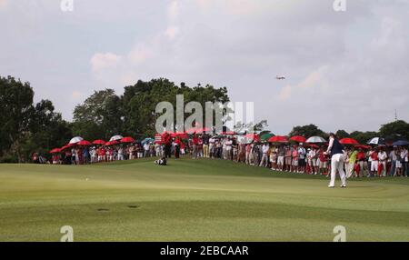 Golf - HSBC Women's Champions 2012 - Tanah Merah Country Club, Garden Course, Singapore - 26/2/12  China's Shanshan Feng putts as an airplane flies overhead on the 1st during the final round  Mandatory Credit: Action Images / Jeremy Lee  Livepic