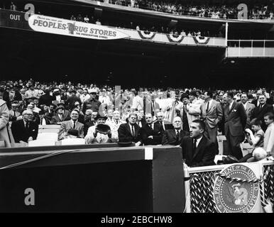 Opening Day at D.C. Stadium, 1962 Baseball Season, 2:00PM. President John  F. Kennedy signs a Washington Senators Yearbook during Opening Game of 1962  Baseball Season. Washington Senators center fielder Jimmy Piersall holds