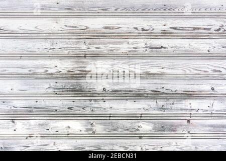 Weathered white painted wooden planks with nailes. Background of ancient wooden boards. Vintage wooden texture. Faded white paint retro planks wall. R Stock Photo