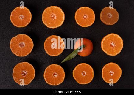 Tangerins pattern on black table. minimal concept Stock Photo