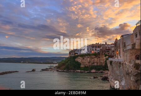 Gargano coast: bay of Vieste in Apulia, Italy. Panoramic view of the old town. Stock Photo