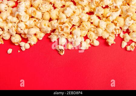 Popcorn on a red background as a concept for movies with space for copy Stock Photo