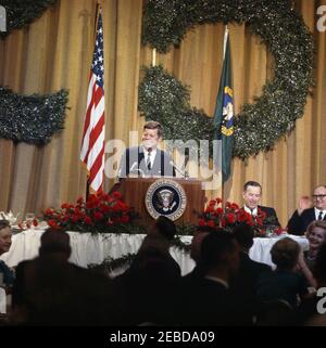 Trip to Western States: Dinner in honor of Senator Warren Magnuson in Seattle, Washington, 9:00PM. President John F. Kennedy addresses the audience at Senator Warren G. Magnusonu2019s (Washington) 25th anniversary dinner in the Grand Ballroom of the Olympic Hotel in Seattle, Washington. Seated to the right of the lectern are (L-R) Senator Henry M. u201cScoopu201d Jackson (Washington) and Albert D. Rosellini, Governor of Washington.