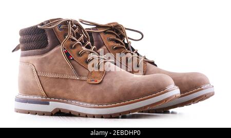 A pair of brown men's winter leather shoes isolated on white background Stock Photo