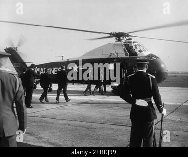 Arrival ceremonies for William Vacanarat Shadrach Tubman, President of Liberia, 10:00 AM. Arrival ceremonies for William V.S. Tubman, President of Liberia. President Tubman and President John F. Kennedy (center, backs to camera) approach United States Marine Corps helicopter. Others unidentified. Andrews Air Force Base, Maryland. Stock Photo