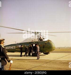 Arrival ceremonies for William Vacanarat Shadrach Tubman, President of Liberia, 10:00 AM. Arrival ceremonies for William V.S. Tubman, President of Liberia. Chief of Protocol Angier Biddle Duke (far left, wearing hat), President John F. Kennedy (center, back to camera), and others approach United States Marine Corps helicopter. Andrews Air Force Base, Maryland. Stock Photo