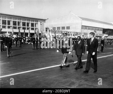 Arrival ceremonies for William Vacanarat Shadrach Tubman, President of Liberia, 10:00 AM. Arrival ceremonies for William V.S. Tubman, President of Liberia. Walking by honor guard (L u2013 R): Unidentified officer; President Tubman; President John F. Kennedy. Andrews Air Force Base, Maryland. Stock Photo