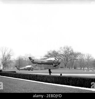 President Kennedy departs White House via helicopter for Andrews Air Force Base, 1:50PM. View of the South Lawn of the White House, Washington, D.C., as Marine One, carrying President John F. Kennedy, lifts off the ground. Bound for Andrews Air Force Base, the President would then fly to Palm Beach, Florida. Stock Photo