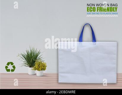 Empty Mockup Bags Isolated on Table with white background. ECO Bags. Copy Space for Text. Stock Photo