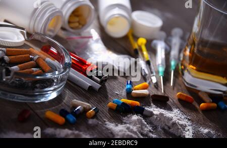 Addictive substances, including alcohol, cigarettes and drugs. Stock Photo