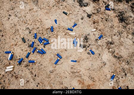 Weapons and military equipment. used ammunition cartridges on a soil. 12 mm Stock Photo