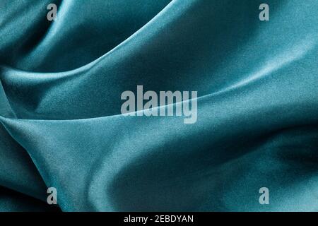 blue silk fabric with waves, elegant wallpaper design, abstract background Stock Photo