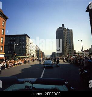 Departure for Newport, Rhode Island, 1:45PM. President John F. Kennedyu2019s motorcade travels to La Guardia Airport, New York City, New York, prior to his departure for Newport, Rhode Island. Children and adults line the streets to greet the President. Stock Photo