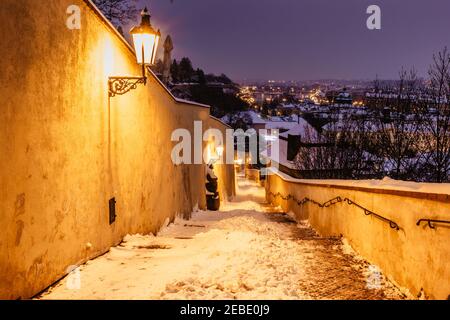 Old Castle Stairs at night, Prague, Czech Republic.Beautiful spectacular winter panorama of Vltava river and historical buildings.Romantic way up Stock Photo