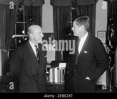 Meeting with the Ambassador of Great Britain, Sir Harold Caccia, 4:46PM. President John F. Kennedy meets with the Ambassador of Great Britain, Sir Harold Caccia, in the Oval Office, White House, Washington, D.C. Stock Photo