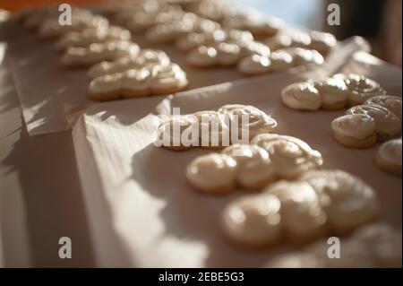 Close up of snowman sugar cookies on baking tray in pretty light Stock Photo