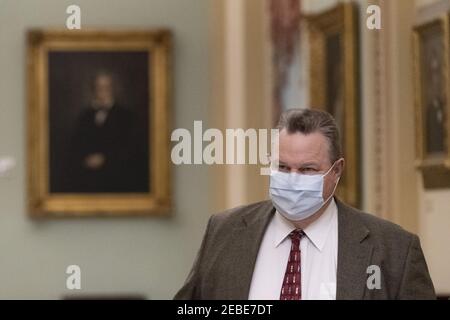 Washington, United States. 12th Feb, 2021. Sen. Jon Tester, D-Mt., arrives for the second impeachment trial of former President Donald Trump at the U.S. Capitol in Washington, DC on Friday, February 12, 2021. Pool photo by Chris Kleponis/UPI Credit: UPI/Alamy Live News Stock Photo
