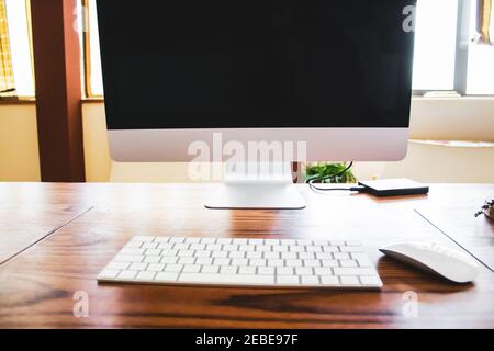 desktop computer on wooden table Stock Photo