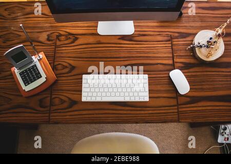 shot of table computer with mouse and keyboard on wooden table Stock Photo