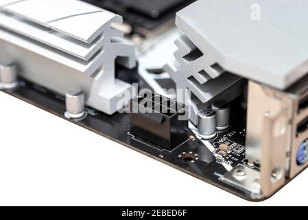 Macro shot of a power connector for 8 pins in a modern motherboard of a desktop computer. Stock Photo