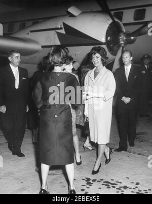 First Lady Jacqueline Kennedy (JBK) arrives at Andrews Air Force Base from Europe. First Lady Jacqueline Kennedy returns from a trip to Europe. (L-R) Air Force Aide to the President Brigadier General Godfrey T. McHugh, two unidentified women, the First Ladyu2019s Press Secretary Pamela Turnure, the First Lady, and State Department Chief of Protocol Angier Biddle Duke. Andrews Air Force Base, Maryland.