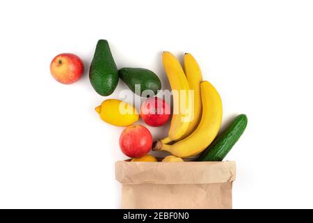 A large assortment of ripe fruits and a craft package on a white background. Stock Photo