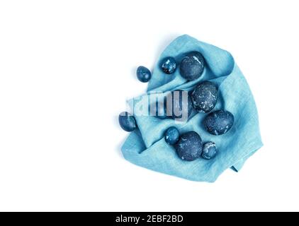 A set of dark blue Easter eggs on a blue napkin. Stock Photo