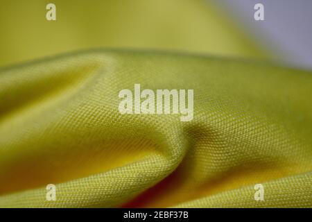 Macro Close up of a Yellow Microfibre Lens Cleaning Cloth Stock Photo