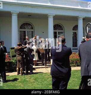 Presentation of the National Teacher of the Year Award to Helen Adams of Cumberland, Wisconsin, 12:45PM. Photographers and reporters watch as President John F. Kennedy presents the 1961 Teacher of the Year Award (a project of the Council of Chief State School Officers) to Helen Adams of Cumberland, Wisconsin. Standing behind Adams and President Kennedy, L-R: Publisher of LOOK Magazine, Vernon C. Myers; Secretary of Health, Education, and Welfare, Abraham Ribicoff; Commissioner of Education, Dr. Sterling M. McMurrin; Managing Editor of LOOK Magazine, William B. Arthur; Presidential Assistant, D Stock Photo