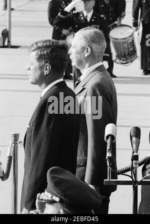 Arrival ceremonies for Harold Macmillan, Prime Minister of Great Britain, 4:50PM. President John F. Kennedy (left) and Prime Minister of Great Britain, Harold Macmillan, stand on the reviewing platform during arrival ceremonies in honor of Prime Minister Macmillan. Andrews Air Force Base, Maryland.