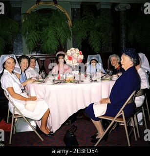 First Lady Jacqueline Kennedy (JBK) attends the Senate Ladies Red Cross Unit Luncheon. First Lady Jacqueline Kennedy attends a luncheon for members of the Senate Ladies Red Cross Unit in the Old Supreme Court Chamber, United States Capitol Building, Washington, D.C. The Red Cross unit (also known as u201cLadies of the Senateu201d) is comprised of the wives of members of the US Senate. Left to right: Noel Clark (wife of Senator Joseph S. Clark of Pennsylvania); Senator Maurine Neuberger (Oregon); unidentified; Mrs. Kennedy; Lady Bird Johnson; Senator Margaret Chase Smith (Maine); Ilo Browne W Stock Photo