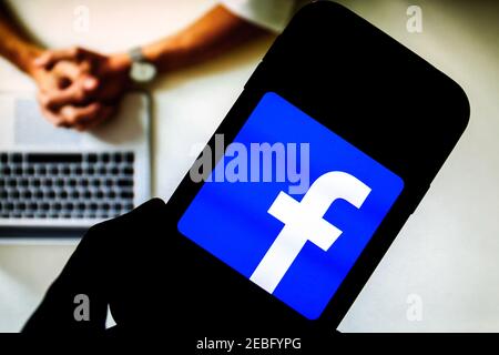 In this photo illustration a Facebook social media app logo seen displayed on a smartphone. Stock Photo