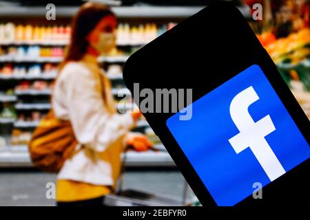 In this photo illustration a Facebook social media app logo seen displayed on a smartphone. Stock Photo