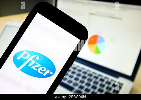 In this photo illustration a Pfizer pharmaceutical company app logo seen displayed on a smartphone. Stock Photo