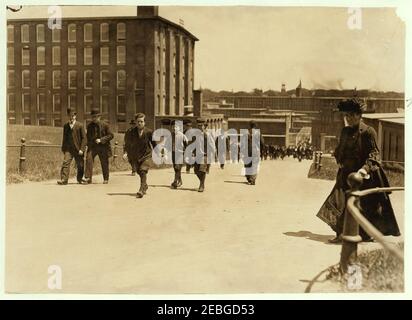 Noon hour, May 26, 1909. These boys and many smaller ones work in Amoskeag Mfg. Co., Manchester, N.H. Stock Photo