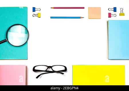 Frame with stationery accessories on a white background. Education and freelancer work concept. Back to school or office Flat lay with copy space. Stock Photo
