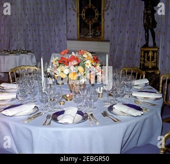 Dinner in honor of Nobel Prize Winners, 8:00PM. View of table settings and a flower arrangement for a dinner in honor of Nobel Prize winners from the Western Hemisphere. Blue Room, White House, Washington, D.C. Stock Photo