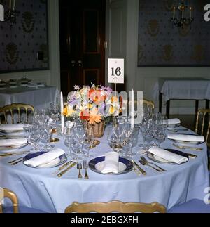 Dinner in honor of Nobel Prize Winners, 8:00PM. View of table settings and a flower arrangement for a dinner in honor of Nobel Prize winners from the Western Hemisphere. Blue Room, White House, Washington, D.C. Stock Photo