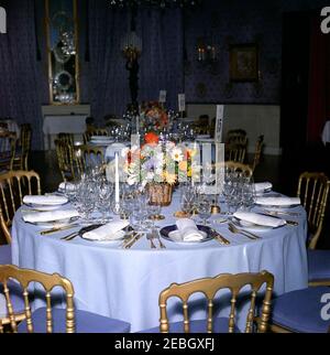 Dinner in honor of Nobel Prize Winners, 8:00PM. View of table settings and a flower arrangement for a dinner in honor of Nobel Prize winners from the Western Hemisphere. Blue Room, White House, Washington, D.C. Stock Photo