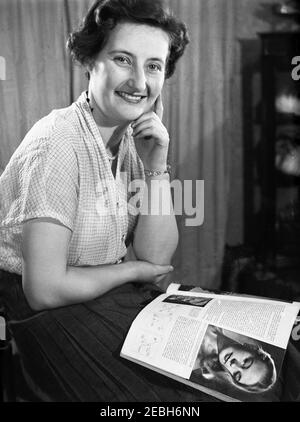 1950s, historical, a lady sitting with a magazine of the era on her lap, England, UK. Stock Photo