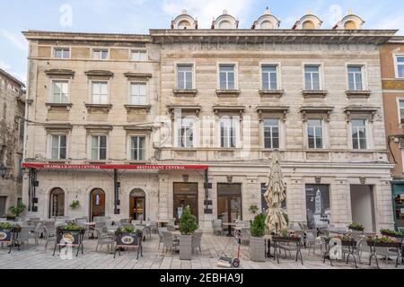 Split, Croatia - Aug 15 2020: Restaurant building facade at People's square Pjaca at old town Stock Photo