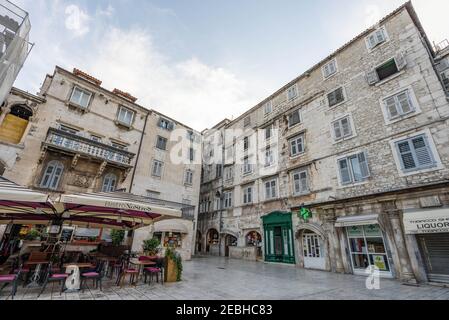 Split, Croatia - Aug 15 2020: Old stone facade at empty People's square Pjaca in the morning Stock Photo