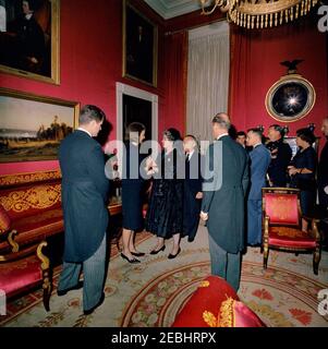 State Funeral of President Kennedy: White House, post funeral Reception. Jacqueline Kennedy and Senator Edward M. Kennedy (Massachusetts) greet guests during a reception at the White House, following the state funeral of President John F. Kennedy; Mrs. Kennedy visits with Queen Frederika of Greece. Also pictured: Minister of Foreign Affairs of Greece, Sophocles Venizelos; Prince Bernhard of the Netherlands; Princess Beatrix of the Netherlands; Minister of Foreign Affairs of the Netherlands, Joseph Luns; U.S. Chief of Protocol, Angier Biddle Duke. Red Room, White House, Washington, D.C. Stock Photo