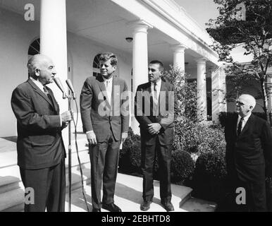Visit of Eskimo u0026 Alaskan Indian electronics trainees, 9:55AM. President John F. Kennedy listens as Senator Ernest Gruening of Alaska (far left) addresses a group of Eskimo and Alaskan Indian electronics trainees in the Rose Garden of the White House, Washington, D.C. Also pictured: Secretary of the Interior, Stewart L. Udall (right of the President); Commissioner of the Bureau of Indian Affairs in the Department of the Interior, Philleo Nash (far right).
